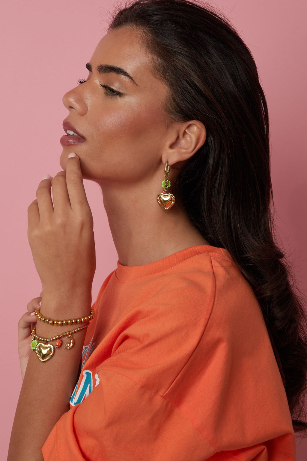 Earrings with colorful beads and detailed heart charm