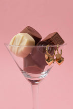 Earrings with different sizes of heart pendants